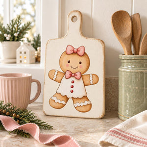 Gingerbread Bakery gingerbread girl transfer on a decorative wooden cutting board.