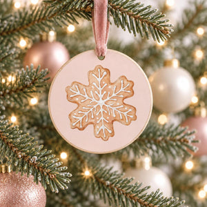 Gingerbread Bakery snowflake cookie transfer on a round pink Christmas ornament.