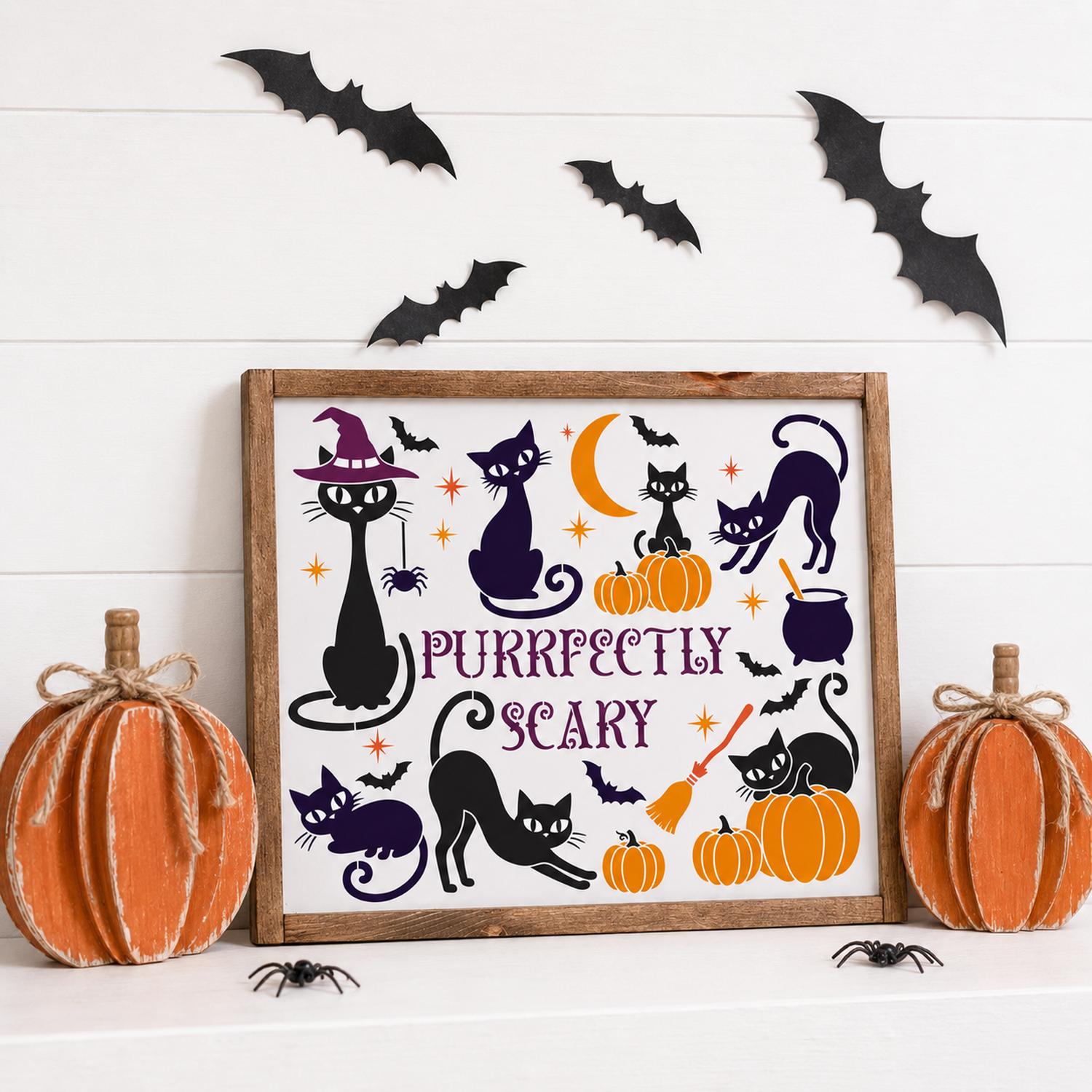 A framed Halloween wall sign with the text 'PURRFEET SCARY' and black cat illustrations, styled on a white surface with decorative pumpkins, black bat cutouts, and spider props against a white shiplap background.