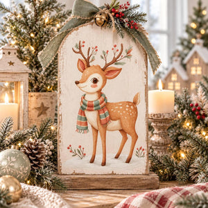 Whimsical Christmas reindeer transfer on an arched wooden holiday sign.